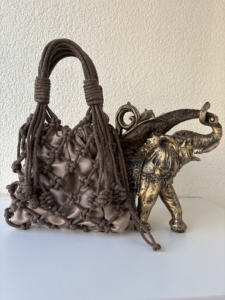 Фото из отзыва к Шнур вязаный 5 мм шоколадный (люрекс золото) с сердечником